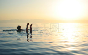 Woman swimming in salty water