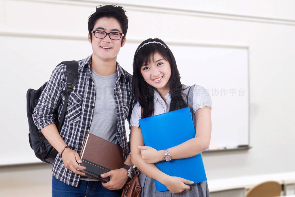 Two college students standing in the class