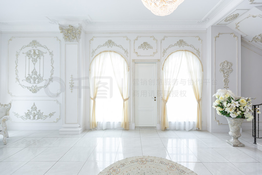 luxury royal posh interior in baroque style. very bright, light and white hall with expensive oldsty