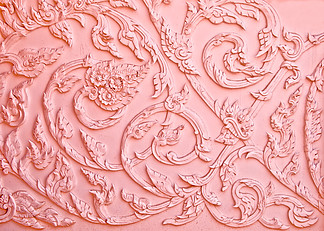 粉红色的灰<i>泥</i>设计的本机的泰式风格，在墙上